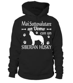 UN UOMO CON UN SIBERIAN HUSKY