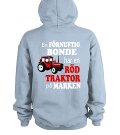 Röd traktor på marken