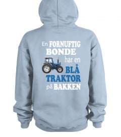 Blå traktor på bakken