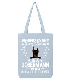 Behind Every Strong Woman Is A Dobermann