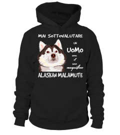 Un UOMO con un ALASKAN MALAMUTE